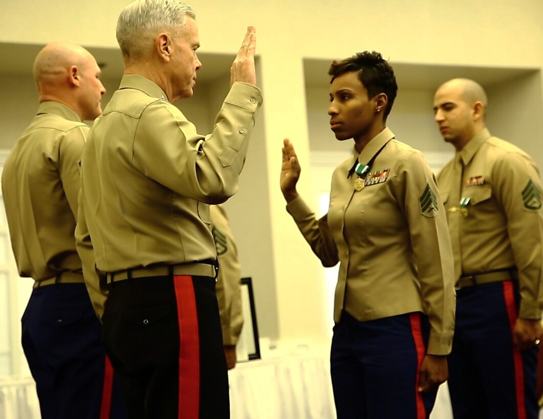 Staff Sgt. Iasia J. Brown, canvassing recruiter, Recruiting Station (RS) Los Angeles, receives a meritorious promotion from Gen. James F. Amos, Commandant of the Marine Corps, during a ceremony, here, Feb. 4. In fiscal year 2013, Brown proved her dedication to finding the most physically, mentally and morally fit individuals to become Marines. Her outstanding work ethic earned her the title of Marine Corps Recruiting Command non-prior service recruiter of the year for FY13.