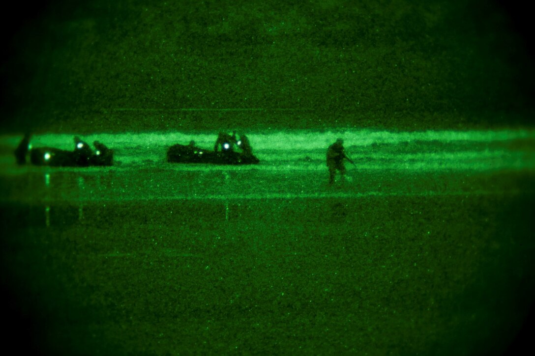 Soldiers with the Japan Ground Self-Defense Force perform a beach landing while conducting an amphibious raid as part of reconnaissance training with the Expeditionary Warfare Training Group Pacific during Exercise Iron Fist 2014 aboard Naval Amphibious Base Coronado, Calif., Feb. 3, 2014. Iron Fist is an amphibious exercise that brings together Marines and sailors from the 15th Marine Expeditionary Unit, other I Marine Expeditionary Force units, and soldiers from the JGSDF, to promote military interoperability and hone individual and small-unit skills through challenging, complex and realistic training. (U.S. Marine Corps photo by Lance Cpl. Ricardo Hurtado/Released)