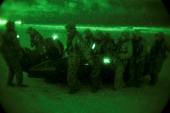 Soldiers with the Japan Ground Self-Defense Force carry a Combat Rubber Reconnaissance Craft to shore while conducting an amphibious raid as part of reconnaissance training with the Expeditionary Warfare Training Group Pacific during Exercise Iron Fist 2014 aboard Naval Amphibious Base Coronado, Calif., Feb. 3, 2014. Iron Fist is an amphibious exercise that brings together Marines and sailors from the 15th Marine Expeditionary Unit, other I Marine Expeditionary Force units, and soldiers from the JGSDF, to promote military interoperability and hone individual and small-unit skills through challenging, complex and realistic training. (U.S. Marine Corps photo by Lance Cpl. Ricardo Hurtado/Released)