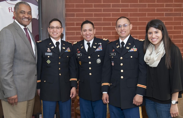 Washington State University President Elson S. Floyd, Capt. Jack Claros, Capt. Joseph Claros, Capt. Donald Claros (now Maj.) and sister Bella Claros. Capt. Joseph Claros is one of three identical brothers and an engineering/logistics officer at the U.S. Army Corps of Engineers Far East District Pyeongtaek Resident Office.