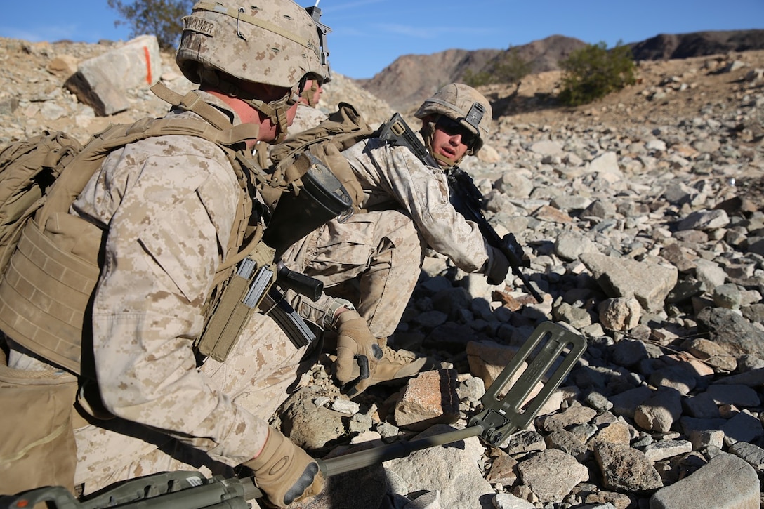 Lance Cpl. Gilbert McCune, right, team leader, Bravo Company, 1st Battalion, 7th Marine Regiment, and Pfc. Dakota Newcomer, rifleman, prepare to move to their next objective during a live-fire exercise at Range 410A at Marine Corps Air Ground Combat Center Twentynine Palms, Calif., Jan. 19, 2014. The battalion conducted platoon attacks at the range for the first event of their Integrated Training Exercise. The exercise is a 30-day training evolution to prepare them for their upcoming combat deployment. The platoon attacks consisted of an assault on three entrenched positions with mortar and machine gun fire.
(U.S. Marine Corps photo by Cpl. Joseph Scanlan / released)
