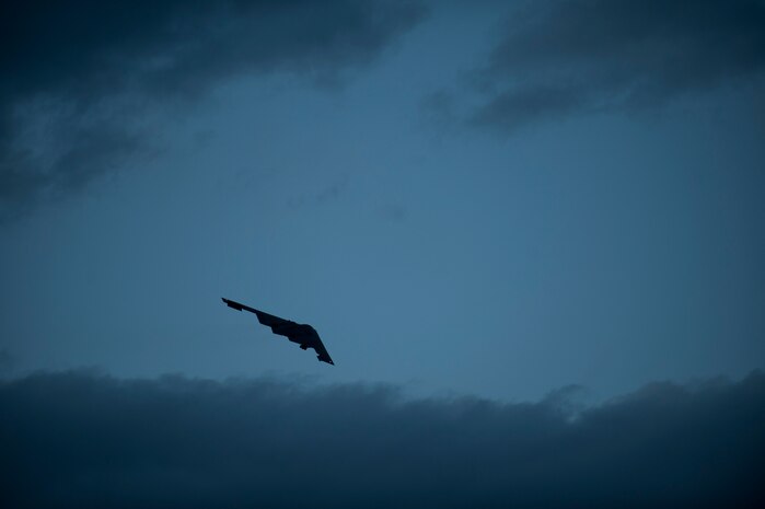 NELLIS AIR FORCE BASE, Nev. -- A B-2 Spirit from the 13th Bomb Squadron, Whiteman Air Force Base, Mo., banks over the flightline at Nellis AFB, Nev., during a Red Flag 14-1 night training mission Jan. 29, 2014. The B-2 is a multi-role bomber capable of delivering both conventional and nuclear munitions.  The 13 BS is participating in Red Flag to show what Global Strike stealth assets do when incorporated into the exercise’s mission planning.  Red Flag night missions present the additional challenge of low visibility, testing the aircrew’s ability to execute the mission at any hour in a contested and degraded environment. (U.S. Air Force photo by Airman 1st Class Joshua Kleinholz)