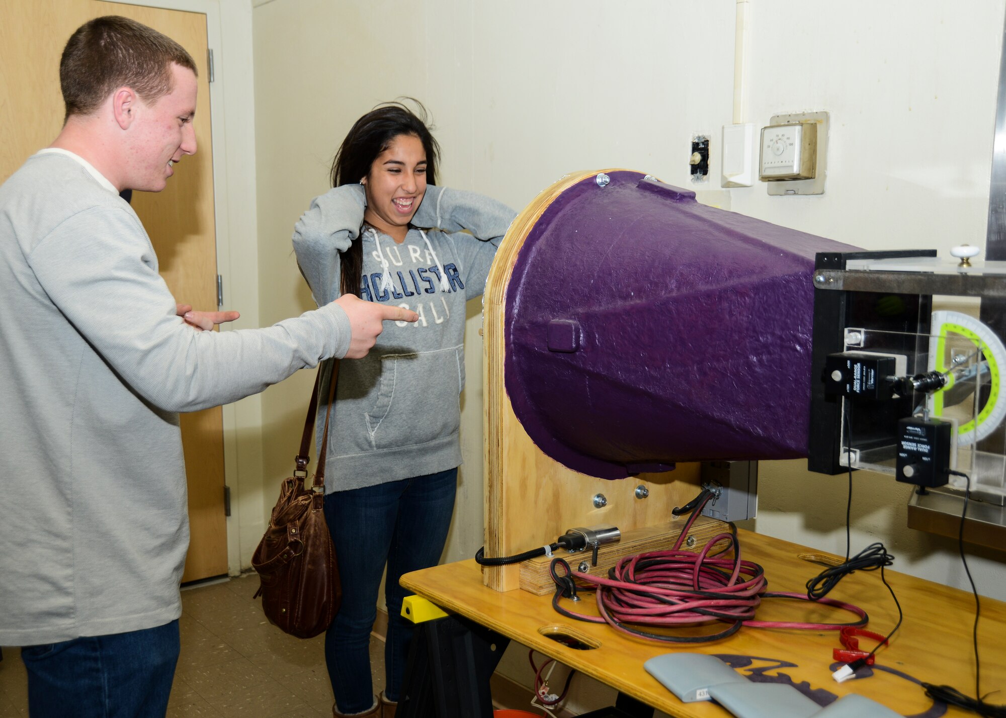 Charles Dobbin, grade 10, demonstrates his wind tunnel to another student at the Science Fair Jan. 31. (U.S. Air Force photo by Rebecca Amber)
