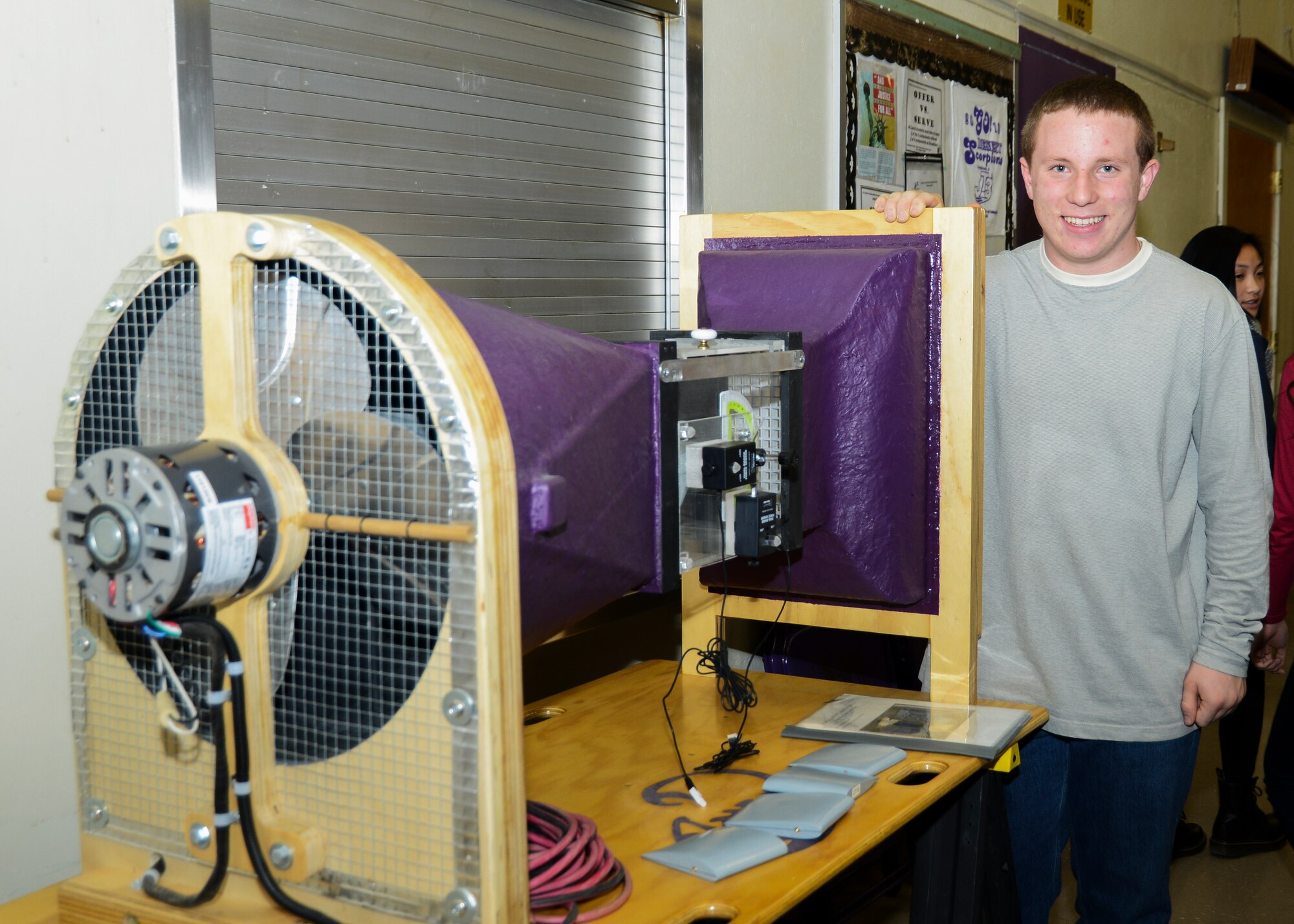 Charles Dobbin, a sophomore at Desert High School, used a wind tunnel that he built with his father to test various air foils and observe their lift and drag coefficients, stall angles and other effects on the wing shape during testing. (U.S. Air Force photo by Rebecca Amber)