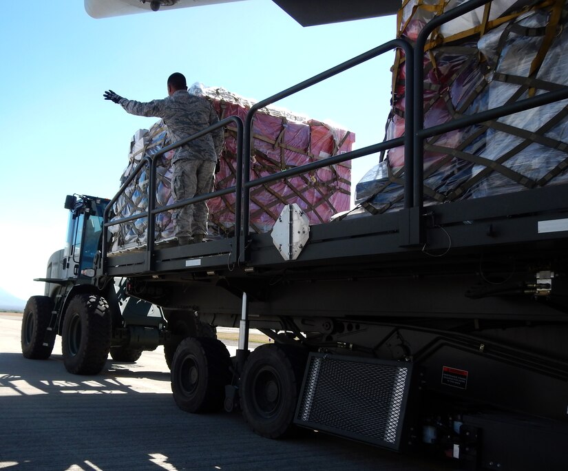 Members of Joint Task Force-Bravo's 612th Air Base Squadron offload pallets of donated medical supplies and equipment from a C-17 Globemaster III aircraft on the flightline at Soto Cano Air Base, Honduras, Feb. 3, 2014.  The medical supplies and equipment The supplies were sent to Honduras through the Denton Program, which allows private U.S. citizens and organizations to use space available on U.S. military cargo planes to transport humanitarian goods to approved countries in need.  The supplies and equipment will be distributed by a non-governmental organization to three hospitals in Honduras.  (U.S. Air Force photo by Tech. Sgt. Stacy Rogers)