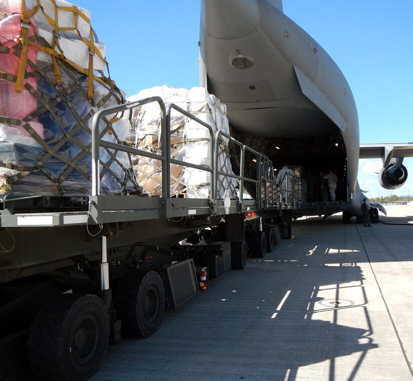 Members of Joint Task Force-Bravo's 612th Air Base Squadron offload pallets of donated medical supplies and equipment from a C-17 Globemaster III aircraft on the flightline at Soto Cano Air Base, Honduras, Feb. 3, 2014.  The medical supplies and equipment The supplies were sent to Honduras through the Denton Program, which allows private U.S. citizens and organizations to use space available on U.S. military cargo planes to transport humanitarian goods to approved countries in need.  The supplies and equipment will be distributed by a non-governmental organization to three hospitals in Honduras.  (U.S. Air Force photo by Tech. Sgt. Stacy Rogers)