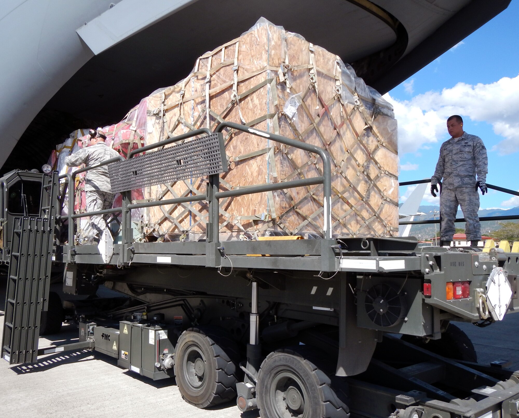 Members of Joint Task Force-Bravo's 612th Air Base Squadron offload pallets of donated medical supplies and equipment from a C-17 Globemaster III aircraft on the flightline at Soto Cano Air Base, Honduras, Feb. 3, 2014.  The medical supplies and equipment The supplies were sent to Honduras through the Denton Program, which allows private U.S. citizens and organizations to use space available on U.S. military cargo planes to transport humanitarian goods to approved countries in need.  The supplies and equipment will be distributed by a non-governmental organization to three hospitals in Honduras.  (U.S. Air Force photo by Tech. Sgt. Stacy Rogers)
