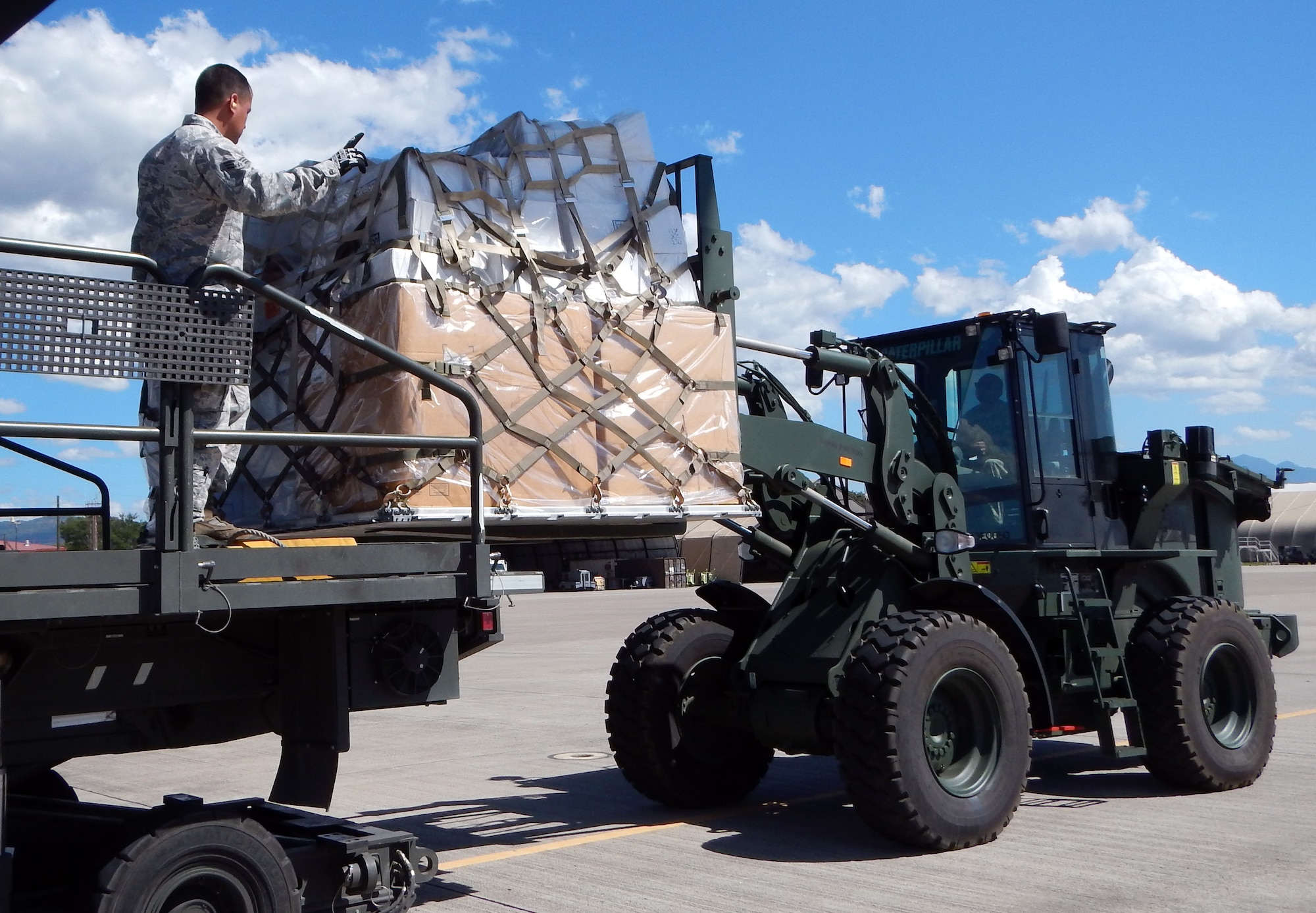 Members of Joint Task Force-Bravo's 612th Air Base Squadron offload pallets of donated medical supplies and equipment from a C-17 Globemaster III aircraft on the flightline at Soto Cano Air Base, Honduras, Feb. 3, 2014.  The medical supplies and equipment The supplies were sent to Honduras through the Denton Program, which allows private U.S. citizens and organizations to use space available on U.S. military cargo planes to transport humanitarian goods to approved countries in need.  The supplies and equipment will be distributed by a non-governmental organization to three hospitals in Honduras.  (U.S. Air Force photo by Tech. Sgt. Stacy Rogers)