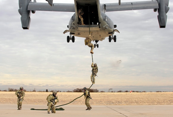 Soldiers of the 7th Special Forces Group fast rope from a CV-22 Osprey during an Emergency Deployment Readiness Exercise at Cannon Air Force Base, N.M., Jan. 27, 2014. The CV-22 Osprey's mission is to conduct long-range infiltration, exfiltration and resupply missions for special operations forces. (U.S. Air Force photo/Staff Sgt. Jeff Andrejcik)