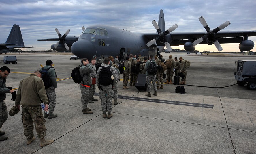 Hurlburt Field Airmen prepare to board a C-130 Hercules at Hurlburt Field, Fla., Jan. 24, 2014. The Airmen participated in an emergency deployment readiness exercise being conducted at Cannon Air Force Base, N.M. (U.S. Air Force photo/Staff Sgt. Jeff Andrejcik)