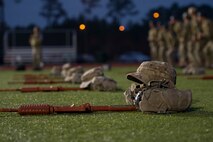 Mock M-16 rifles, canteens and boonie hats lay on the track at Hurlburt Field, Fla., Feb. 4, 2014. Tactical Air Control Party candidates from Hawk Flight 94, Detachment 3, 342nd Training Squadron, carry these accoutrements daily while in training.  (U.S. Air Force photo/Senior Airman Naomi Griego)