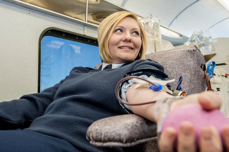 Staff Sgt. Seanna Hawley gives blood with the Inland Northwest Blood Center at Fairchild Air Force Base, Wash., Jan. 31, 2014. Every month the INBC sets up at locations such as the Exchange and Medical Group to offer service members the opportunity to give back to their community. Hawley is the 92nd Medical Support Squadron resource management NCO in charge and a Little Rock, Ark., native. (U.S. Air Force photo by Staff Sgt. Benjamin W. Stratton/Released)