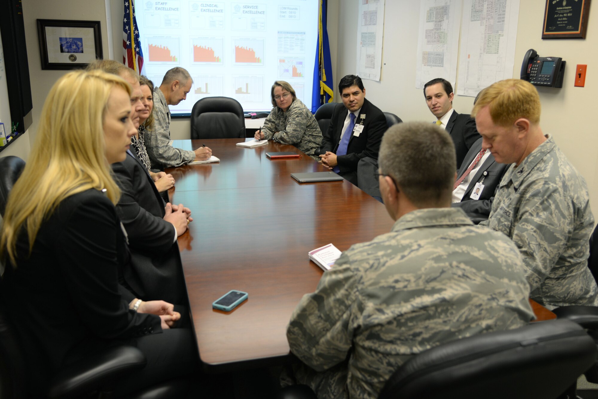 59th Medical Operations Group leaders meet with members of the Baptist Health System after conducting daily rounds to review the progress of each duty section at Wilford Hall Ambulatory Surgical Center Jan. 30, 2014. 59th MDOG Commander Col. John Andrus adopted the lean daily management program from BHS, and invited their staff to join his team to share best practices. (U.S. Air Force photo / Staff Sgt. Christopher Carwile)