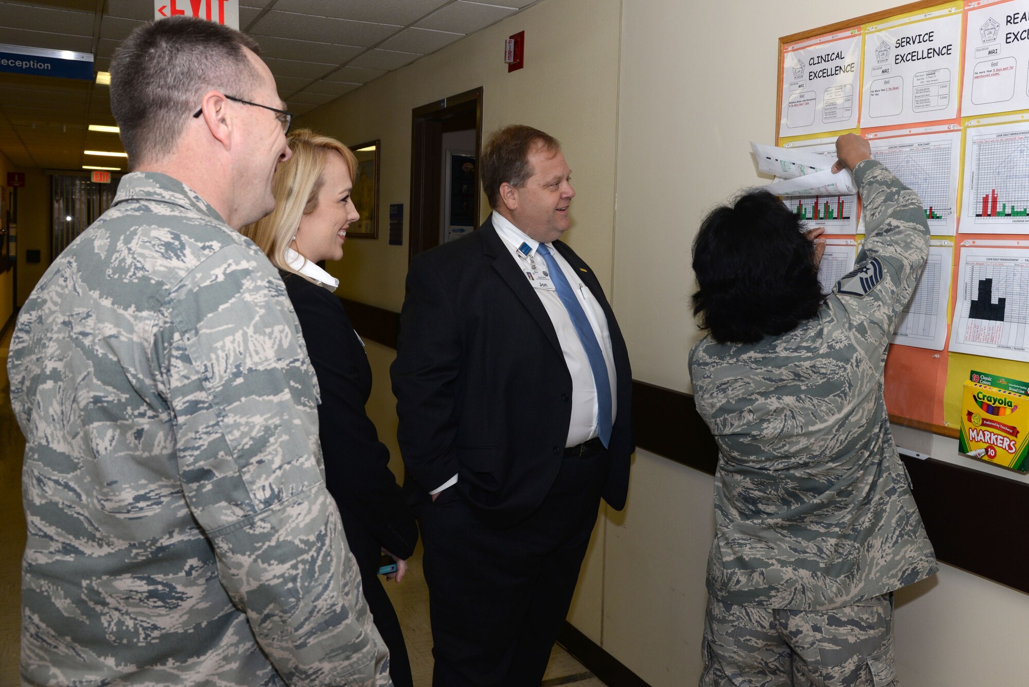 Col. John Andrus, 59th Medical Operations Group commander, and two members of the Baptist Healthcare System receive a brief overview from Master Sgt. Celia Hermesch, MRI non-commissioned officer in charge, on the Radiology Squadron’s goals at Wilford Hall Ambulatory Surgical Center Jan. 30, 2014. Andrus invited members of the BHS to join his team during daily rounds, a process improvement effort which allows each duty section to report their progress on goals aimed at improving clinical, logistical and administrative processes. (U.S. Air Force photo / Staff Sgt. Christopher Carwile)