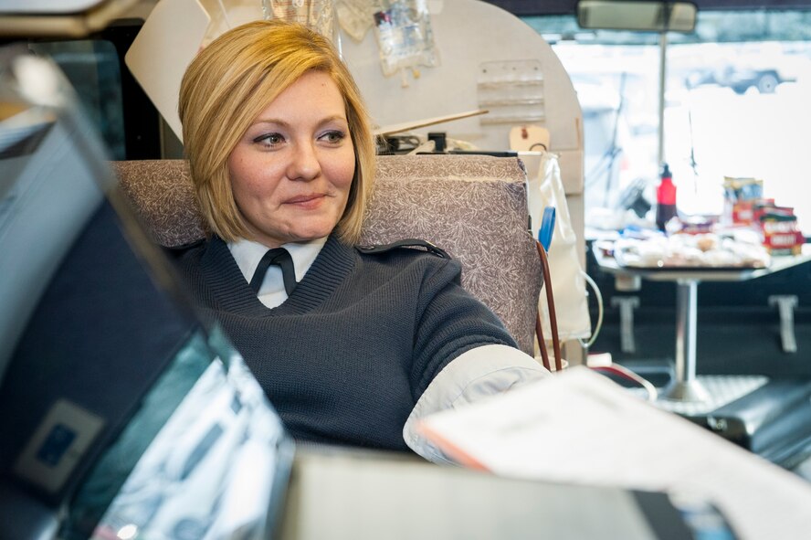 Staff Sgt. Seanna Hawley gives blood with the Inland Northwest Blood Center at Fairchild Air Force Base, Wash., Jan. 31, 2014. Every month the INBC sets up at locations such as the Exchange and Medical Group to offer service members the opportunity to give back to their community. Hawley is the 92nd Medical Support Squadron resource management NCO in charge and a Little Rock, Ark., native. (U.S. Air Force photo by Staff Sgt. Benjamin W. Stratton/Released)