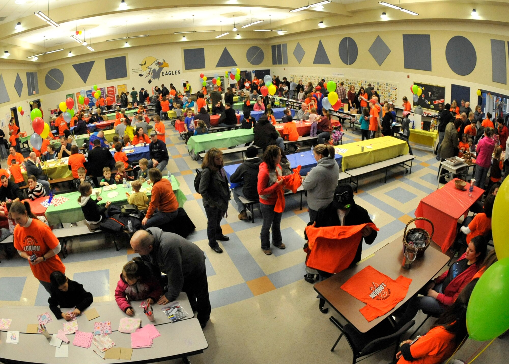 An event held at Michael Anderson Elementary School was hosted in honor of London Bowater, a first-grader who was diagnosed with Acute Lymphoblastic Leukemia in February 2012 at Fairchild Air Force Base, Wash., Feb. 1, 2014. Many members of the Fairchild and local community supplied auctionable items for members to bid on, sold t-shirts, food and drinks, with all proceeds donated directly to London's family. (U.S. Air Force photo by Senior Airman Mary O'Dell/Released)