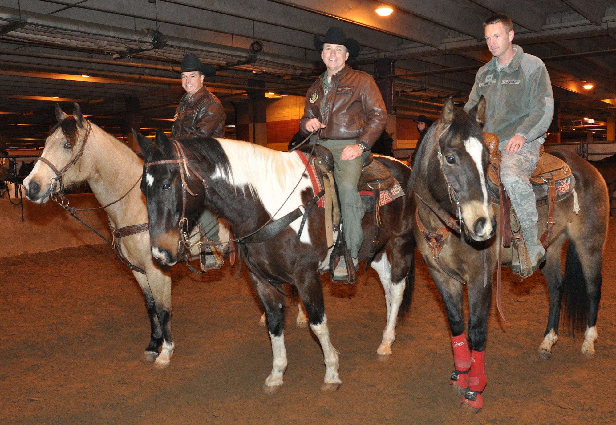 It was an exciting day at Fort Worth Stock Show and Rodeo's Military Appreciation Day yesterday. Col. John Breazeale, 301st Fighter Wing commander, Col. Chris Yancy, 301st FW vice commander, and Tech. Sgt. Larry Marsh, 301st FW's 2013 NCO of the Year, rode in the grand entry prior to enjoying the sights and sounds of this historic annual event. (U.S. Air Force photo/Master Sgt. Julie Briden-Garcia)