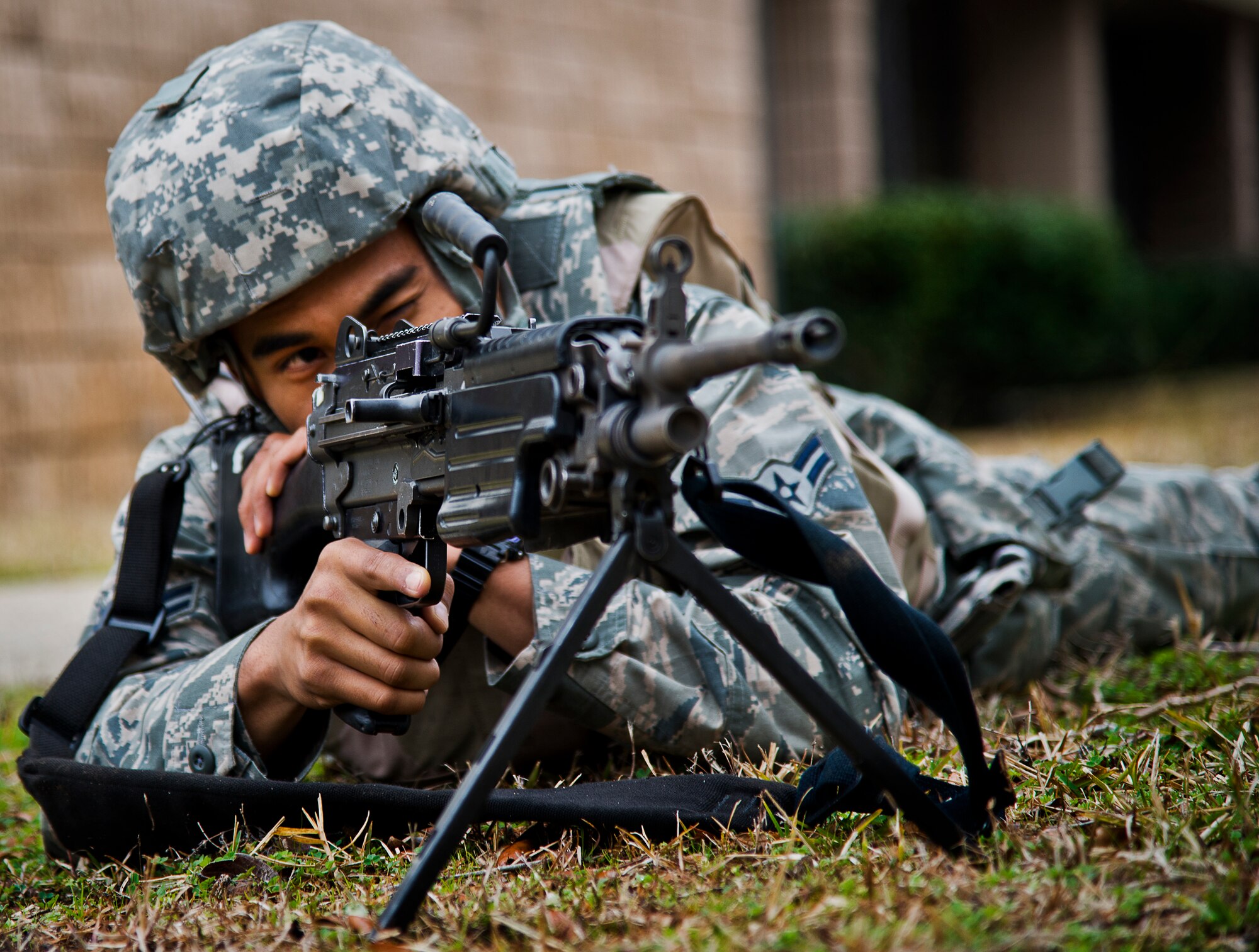 Airman 1st Class Jesse Cruz, of the 96th Security Forces Squadron, points his weapon toward scene of an active-shooter exercise at Eglin Air Force Base, Fla., Feb. 4.  The active-shooter was the second of a series of 96th Test Wing exercises occurring all week.  (U.S. Air Force photo/Samuel King Jr.)