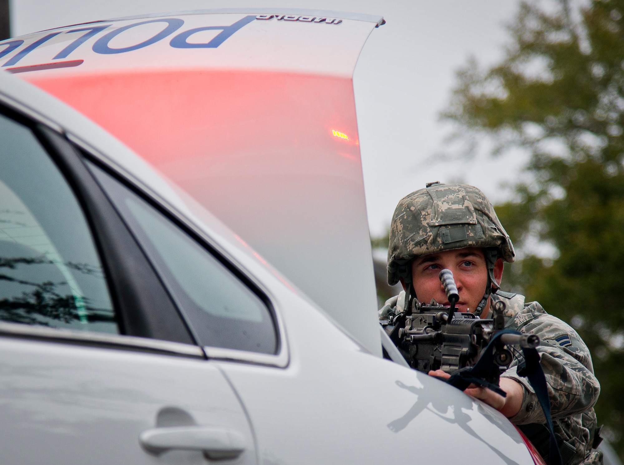 Airman 1st Class Brandon Gorgas, from the 96th Security Forces Squadron, points his weapon toward scene of an active-shooter exercise at Eglin Air Force Base, Fla., Feb. 4.  The active-shooter was the second of a series of 96th Test Wing exercises occurring all week.  (U.S. Air Force photo/Samuel King Jr.)