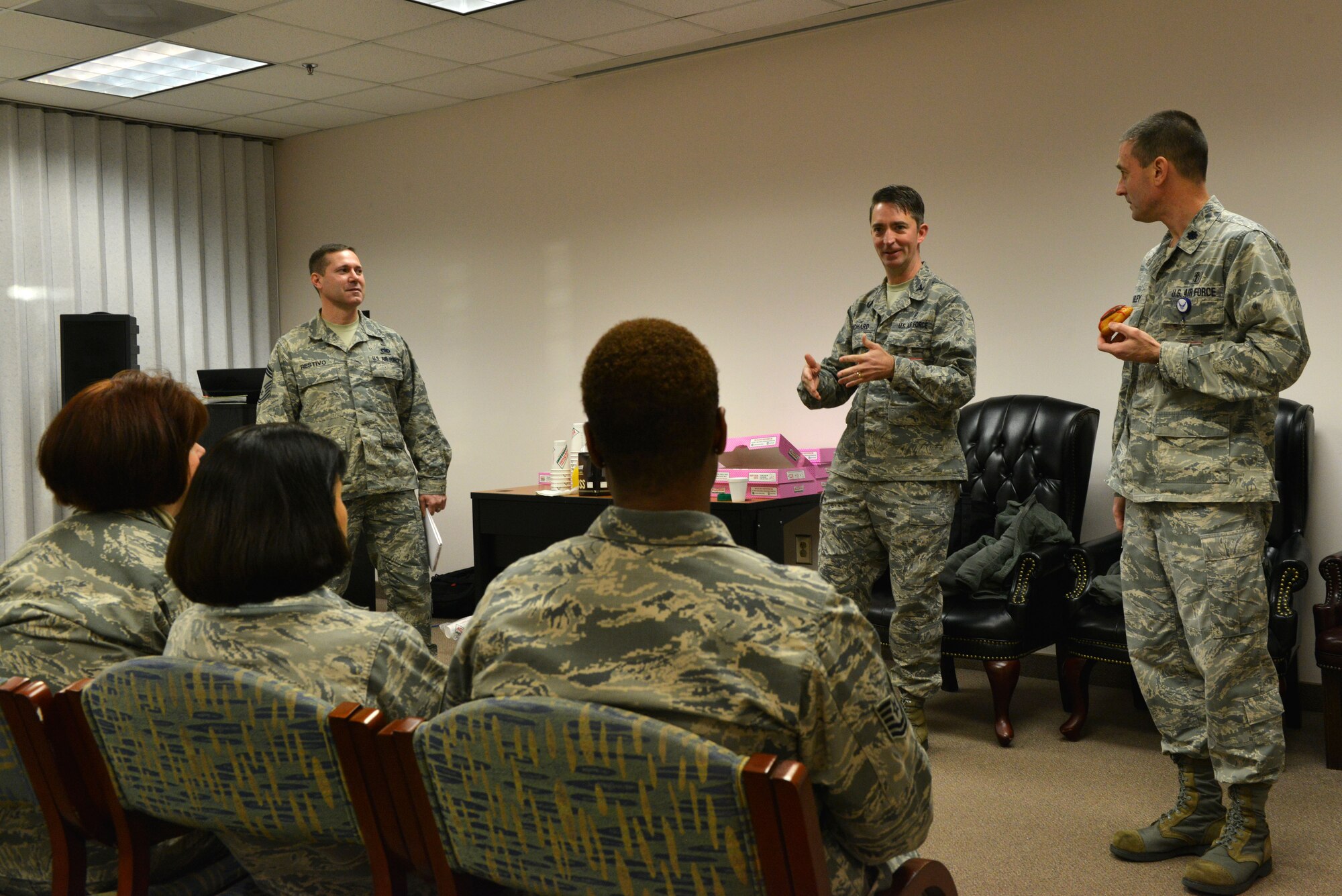 U.S. Air Force Col. Curt Prichard, 20th Medical Group commander, speaks to Biomedical Sciences Corps officers during a morning coffee and doughnuts gathering at Shaw Air Force Base, S.C., Jan. 31, 2014. The officers were taking part in BSC appreciation week which included a morning of free coffee, doughnuts and orange juice. (U.S. Air Force photo by Airman 1st Class Jensen Stidham/Released)