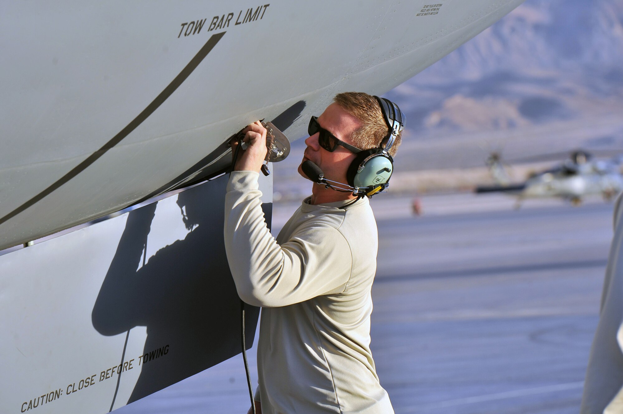 Tech. Sgt. Michael Friend, 22nd Aircraft Maintenance Squadron crew chief, checks a gases and oxygen panel on a KC-135 Stratotanker from Fairchild Air Force Base, Wash., after it landed at Nellis AFB, Nev., during Red Flag 14-1 Jan. 30, 2014. Red Flag gives service members from the U.S. and allied countries an opportunity to experience realistic combat scenarios to prepare and train them in the event of future conflicts or war. (U.S. Air Force photo by Staff Sgt. Veronica Montes)