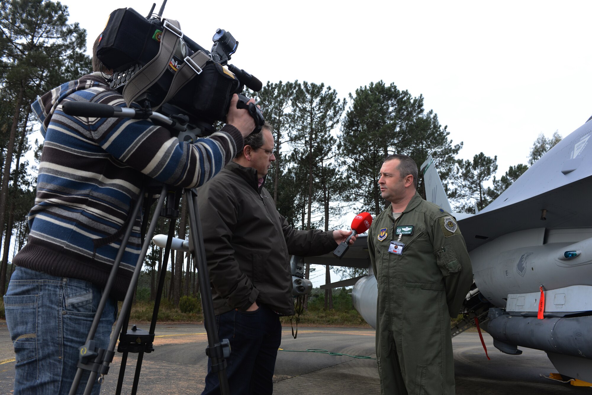 Lt. Col. John Peterson, 555th Fighter Squadron commander, speaks with a national Portuguese television station Feb. 4 during REAL THAW 14 at Monte Real Air Base, Portugal. This is the first year that members of the 555th Fighter Squadron have traveled to Portugal in support of an international exercise. (U.S. Air Force photo/2nd Lt. Allie Delury)