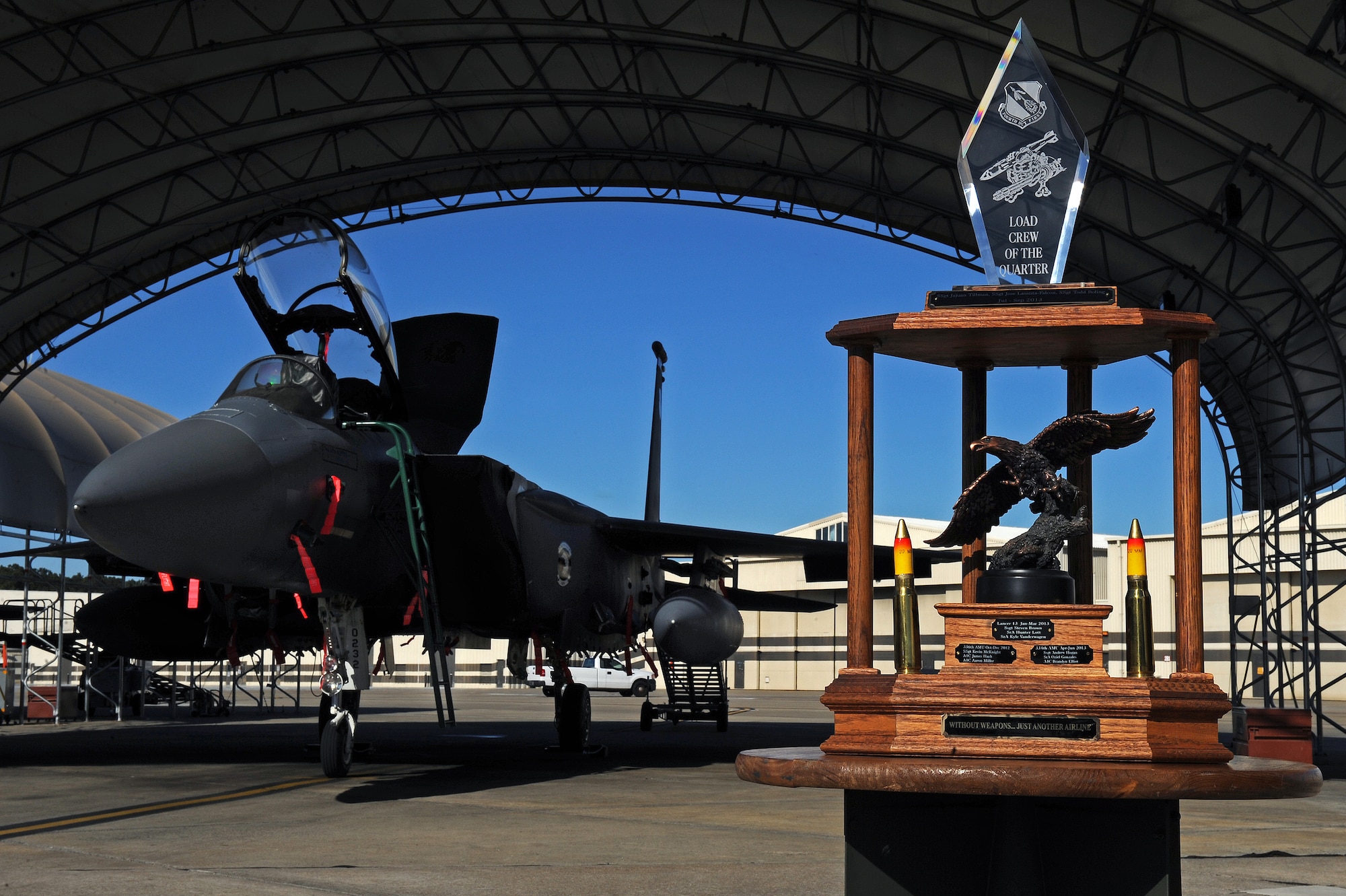 U.S. Air Force Airmen assigned to the 4th Aircraft Maintenance Squadron participate in a load crew of the quarter competition at Seymour Johnson Air Force Base, N. C., Jan 24, 2013. Three-man teams raced against other aircraft maintenance units to determine which team could most quickly and accurately load munitions to F-15E Strike Eagle aircraft. (U.S. Air Force photo by Airman 1st Class Aaron J. Jenne)