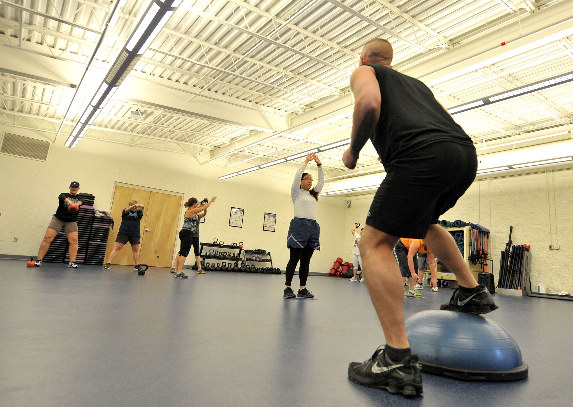 Students in the Kettlebell Fit class participate in circuit-style workouts at Hurlburt Field, Fla., Jan. 27, 2014. The class included 15 minutes of technique, 30 minutes of circuit-style workouts and five to 10 minutes of cool-down stretches. (U.S. Air Force photo/Airman 1st Class Andrea Posey)