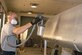 DAYTON, Ohio -- National Museum of the U.S. Air Force restoration specialist Brian Lindamood applies aluminized cellulose nitrate dope to a the Stearman PT-13D Kaydet. This paint serves as a UV protectant which keeps the fabric from deteriorating. Plans call for the aircraft to be part of an expanded Tuskegee Airman exhibit in the World War II Gallery at the National Museum of the U.S. Air Force. (U.S. Air Force photo by Ken LaRock)
