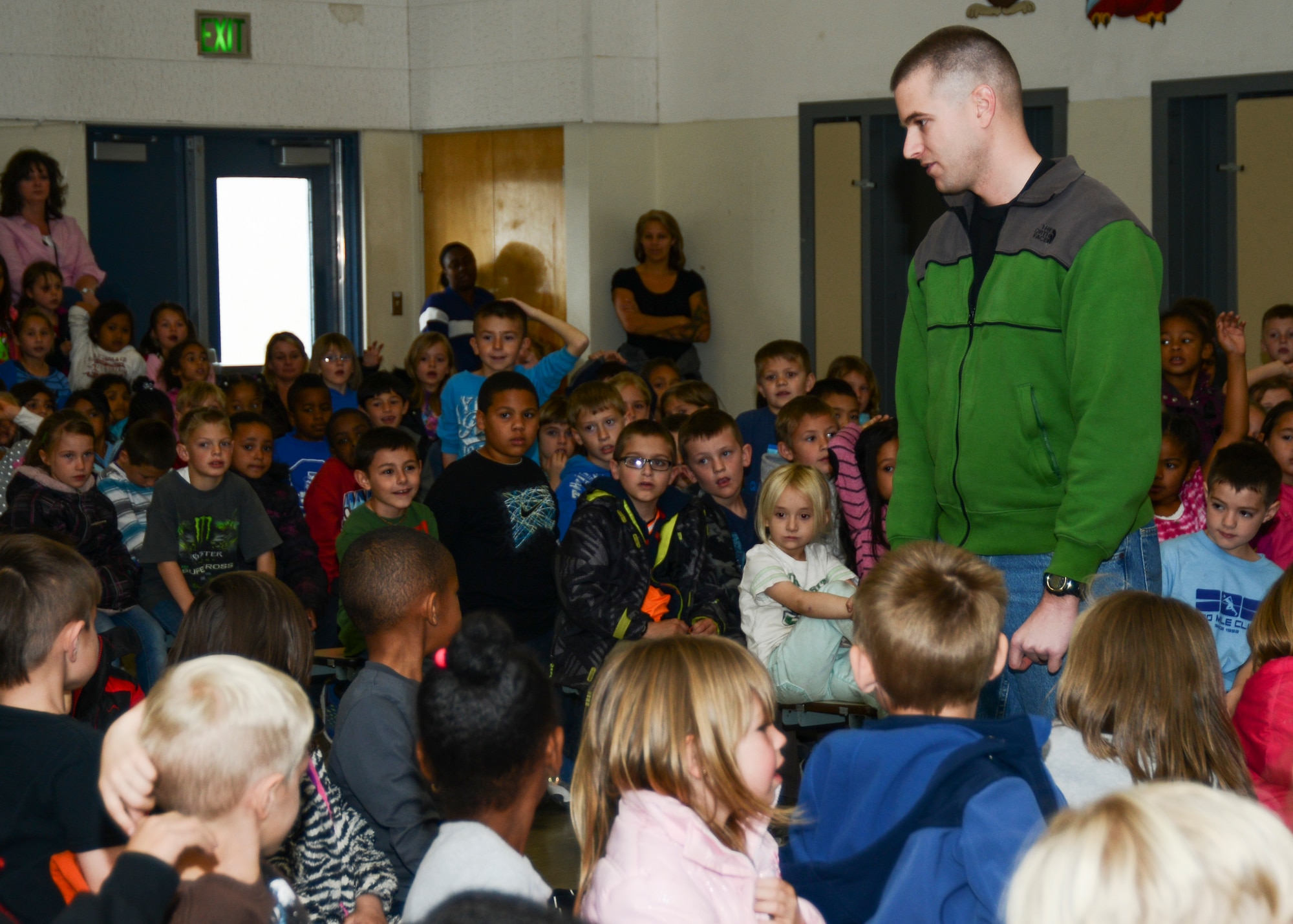 Senior Airman Philip Hamlet, 412th Security Forces Squadron, Police Services, addresses the K through 2nd grade group at Branch Elementary School about bullying during an anti-bullying presentation put on by 412th SFS and the school Jan 30. (U.S. Air Force photo by Rebecca Amber)