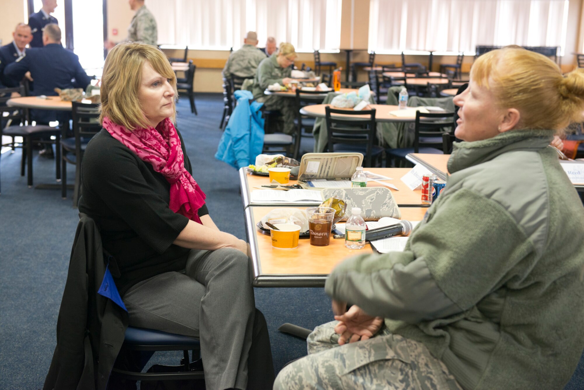 Marie Hotaling,left, wife of Chief Master Sgt. James Hotaling, Command Chief of the Air National Guard discusses childcare services for unit members with Master Sgt. Donna Sliger during a visit to the 167th Airlift Wing Jan. 31. The trip was geared toward identifying challenges facing Airmen and their families. (Air National Guard photo by Master Sgt. Emily Beightol-Deyerle) 