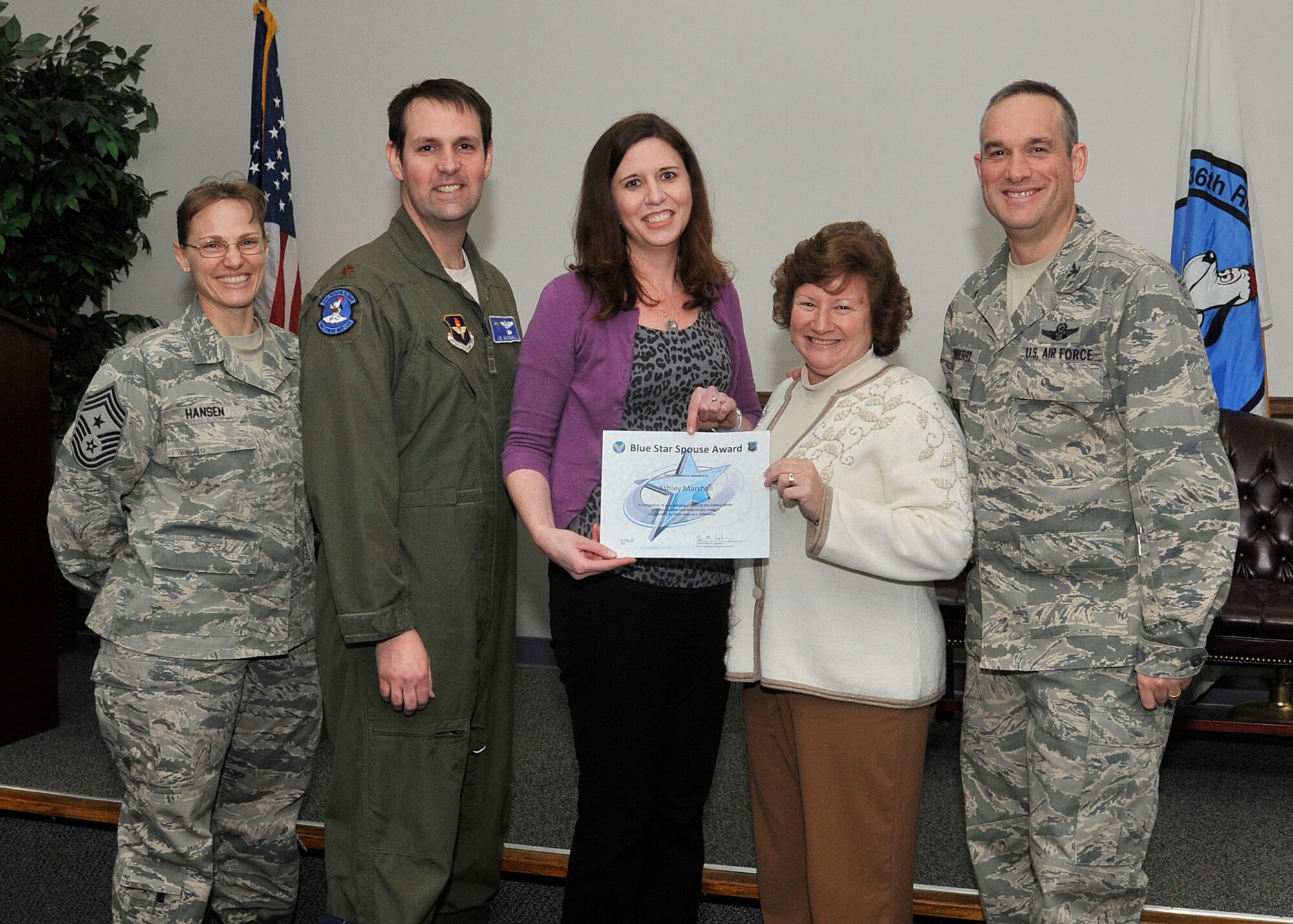 Col. Brian Newberry, 92nd Air Refueling Wing commander, his wife, Jill, and
Chief Master Sgt. Wendy Hansen, 92nd ARW Command Chief, present the Blue
Star Spouse Award to Mrs. Ashley Marshall, at Fairchild Air Force Base,
Wash., Feb. 3, 2014. Her husband, Maj. J.B. Marshall, 36th Rescue flight
commander, was present to help congratulate her. This award is presented to
Fairchild spouses for their commitment to excellence and support of the
Fairchild family. Her selfless contributions supporting 36th families and
her personal career sacrifices to better the Air Force have immeasurably
strengthened the Air Force community. Anyone interested in nominating
someone for the Blue Star Spouse Award should contact their squadron
commander. (U.S. Air Force photo by Senior Airman Mary O'Dell/Released)