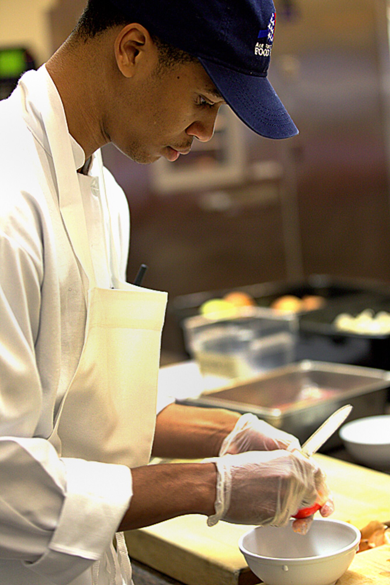 Senior Airman Keith Smith perfects his food preparation skills. Smith, a Reservist with the 908th Force Support Squadron, recently attended the Armed Forces Forum for Culinary Excellence at the Culinary Institute of America at Greystone in St. Helena, Calif. 
(Courtesy photo/National Restaurant Association © 2013 Celene Di Stasio)