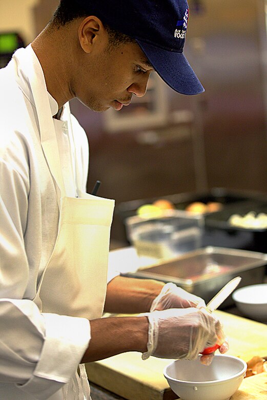 Senior Airman Keith Smith perfects his food preparation skills. Smith, a Reservist with the 908th Force Support Squadron, recently attended the Armed Forces Forum for Culinary Excellence at the Culinary Institute of America at Greystone in St. Helena, Calif. 
(Courtesy photo/National Restaurant Association © 2013 Celene Di Stasio)