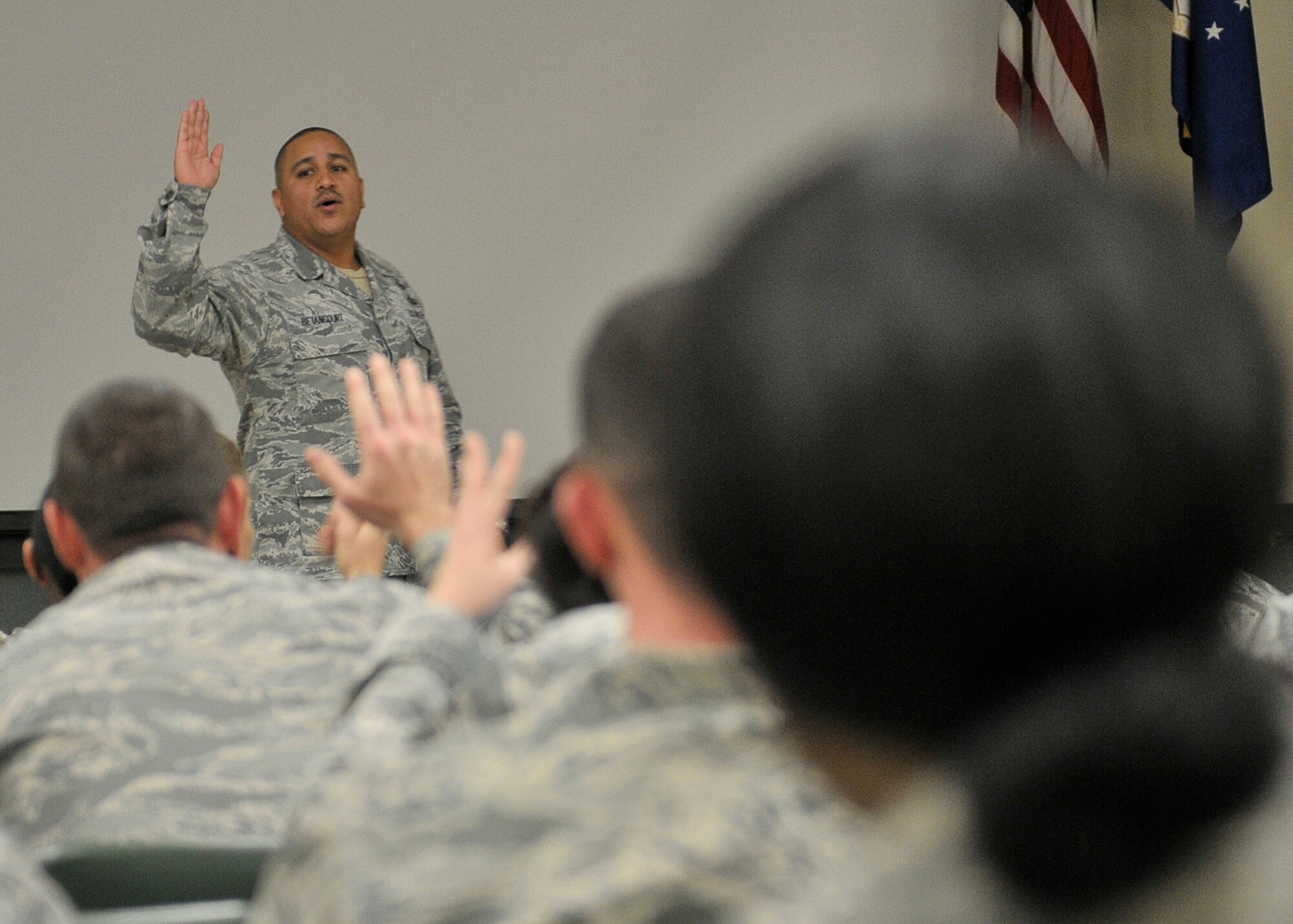 Master Sgt. Ricardo Betancourt, 601st Air Operations Center systems tester, asks the audience if there are any leaders in the room Jan. 24 at the Tyndall Red Horse auditorium. Betancourt informed the Airmen of the Toastmasters organization and the importance of leadership and public speaking. (U.S. Air Force photo by Airman 1st Class Solomon Cook)