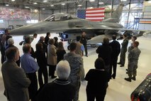 Capt. Michael Casey (center), 419th Fighter Wing pilot, teaches newly inducted honorary commanders about the capabilities of an F-16 Fighting Falcon during a base tour Jan. 23. (U.S. Air Force photo/Alex Lloyd) 