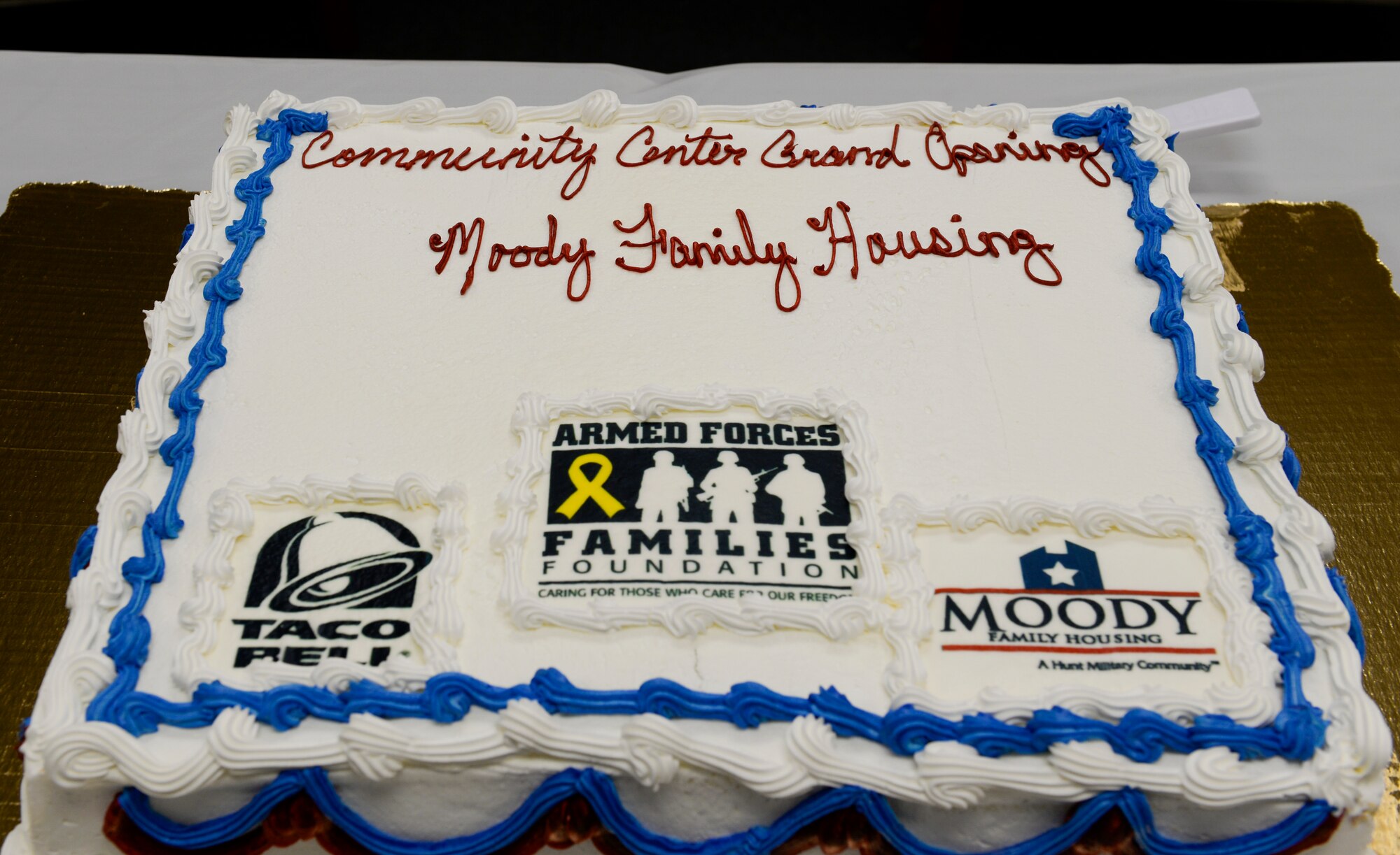 A cake is displayed during the ribbon cutting ceremony for the newly renovated family housing community center at Moody Air Force Base, Ga., Feb. 4, 2014. The ceremony recognized the opening of the community center and thanked all the organizations who contributed. (U.S. Air Force photo by Senior Airman Olivia Bumpers/Released)