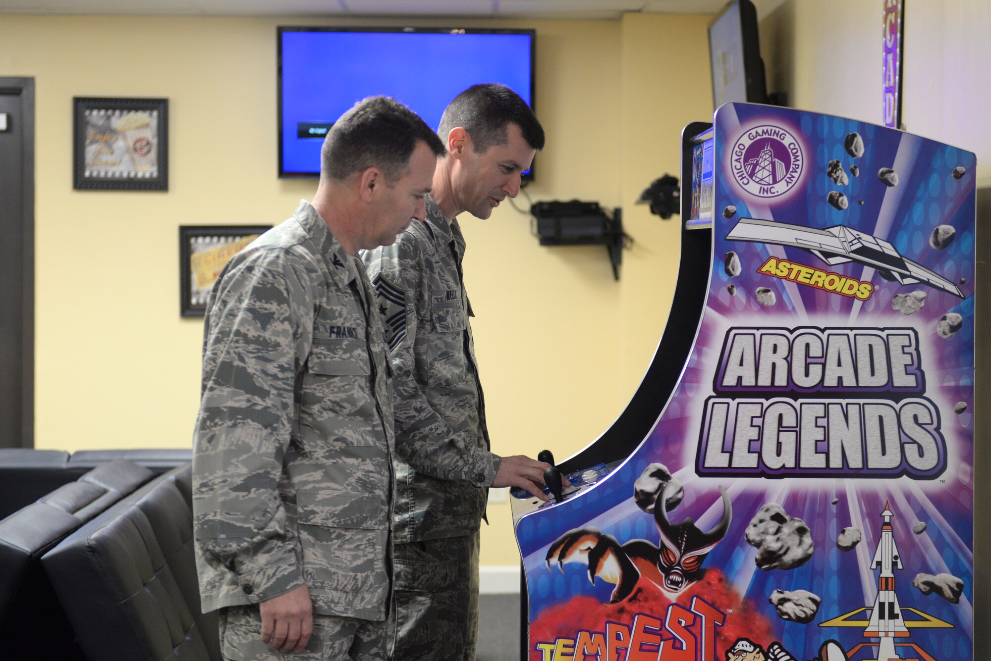 U.S. Air Force Col. Chad Franks, 23d Wing commander, and Chief Master Sgt. Matthew Wells, 23d WG command chief, tour the game room in the newly renovated family housing community center at Moody Air Force Base, Ga., Feb. 4, 2014.The community center was created to provide a place for residents to gather for social and recreational activities. (U.S. Air Force photo by Senior Airman Olivia Bumpers/Released)