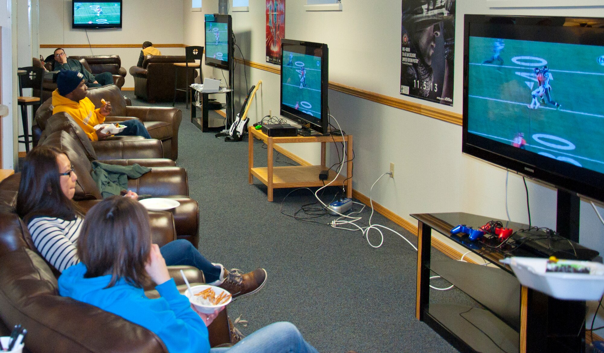 140202-F-GZ967-003 Four televisions, all tuned in to the “Big Game,” line the walls of the Airmen’s Oasis during a Superbowl party Feb. 2. (U.S. Air Force photo by Airman 1st Class Brandon Valle)