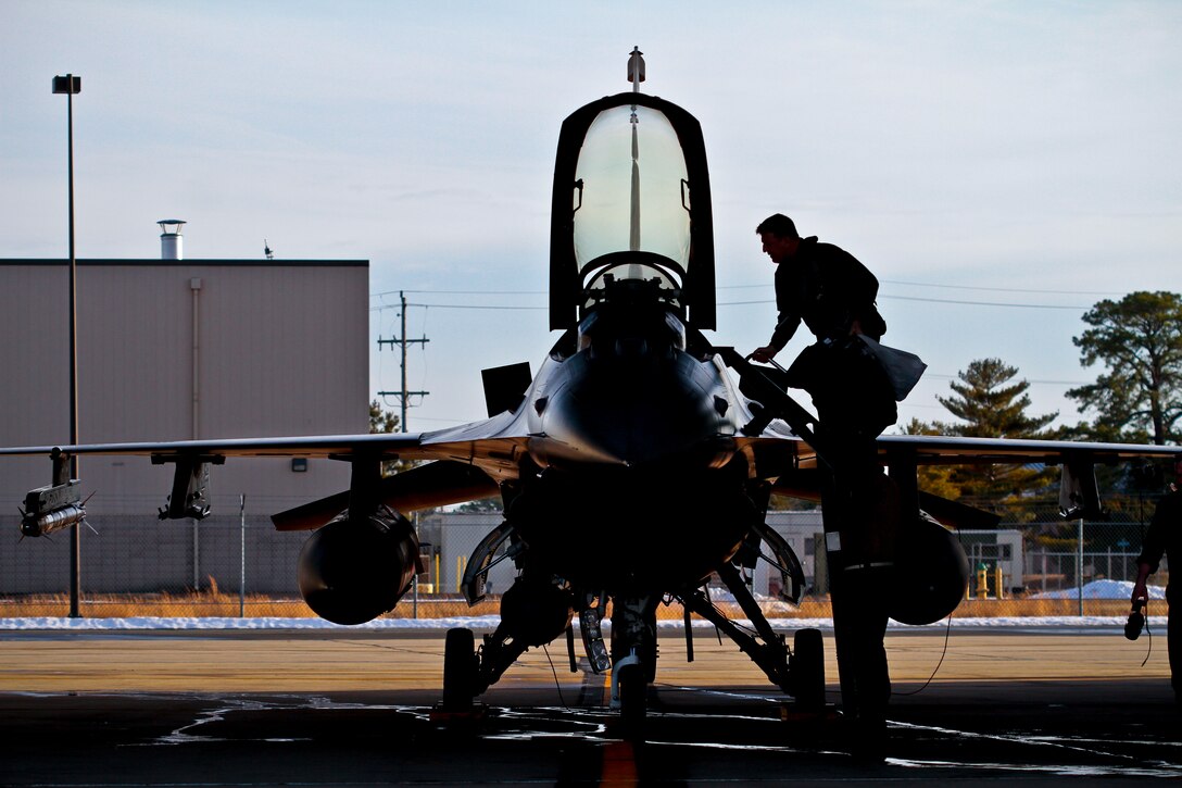 U.S. Air Force Col. Bradford Everman from the New Jersey Air National Guard's 177th Fighter Wing boards his F-16C Fighting Falcon prior to takeoff in support of the total force security mission for Super Bowl XLVIII on Feb. 2, 2014, at Atlantic City Air National Guard Base, N.J. Everman is the 177th Operations Group commander.  (U.S. Air National Guard photo by Tech. Sgt. Matt Hecht)