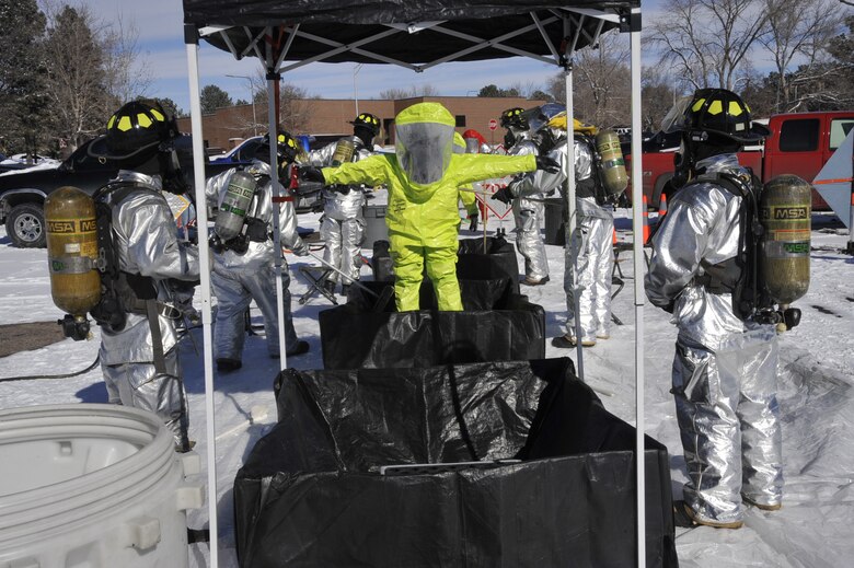 PETERSON AIR FORCE BASE, Colo. – First responders from the 21st Medical Squadron are processed through a decontamination area after confirming the presence of a chemical agent during an emergency management exercise here Jan. 28. Condor Crest is designed to test and evaluate installation response to a real-world crisis or base wide situation that requires command and control, first responder employment and cooperation with local law enforcement and community leaders. (U.S. Air Force photo/Robb Lingley)
