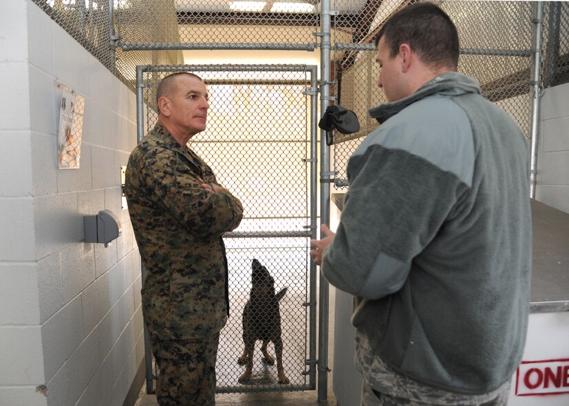 U.S. Marine Corps Sgt. Maj. Bryan Battaglia, the senior enlisted advisor to the chairman of the Joint Chiefs of Staff, speaks with Tech. Sgt. Clayton Tebbetts, 2nd Security Forces Squadron kennel master on Barksdale Air Force Base, La., Jan. 30, 2014. Tebbetts talked with Battaglia about the duties of the working dog and their day-to-day operations. (U.S. Air Force photo/Senior Airman Joseph A. Pagán Jr.)