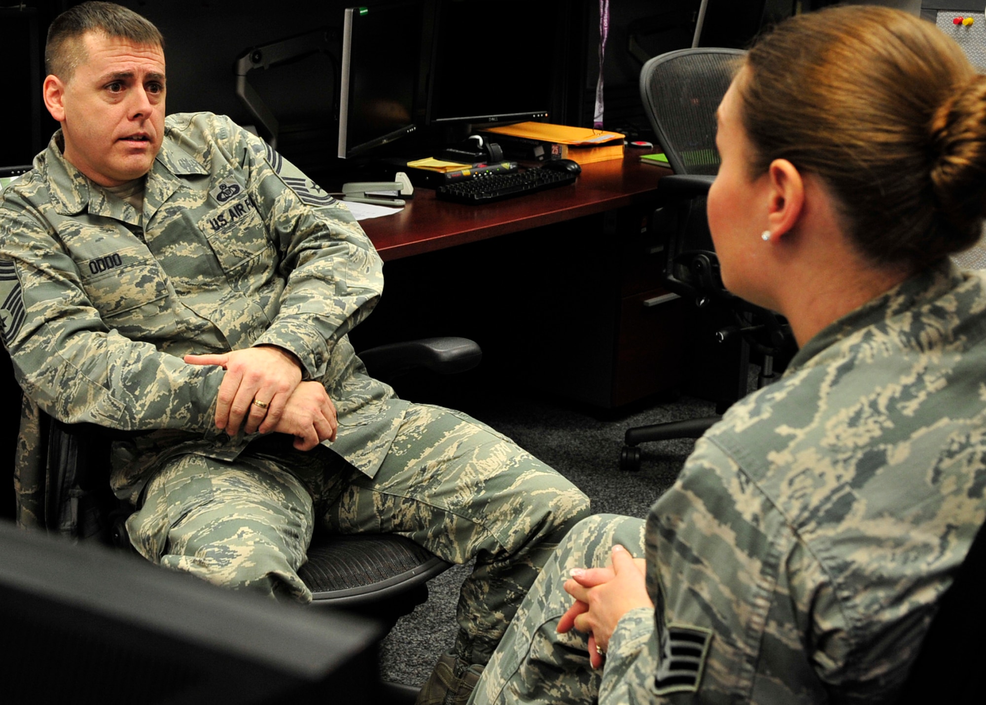 Chief Master Sgt. David Oddo, 603rd Air and Space Operations Center superintendent, counsels an Airman, Jan. 24, 2014, Ramstein Air Base, Germany. Oddo has an open-door policy with his Airmen to provide support and get them additional help if needed. (U.S. Air Force photo/Airman Larissa Greatwood)