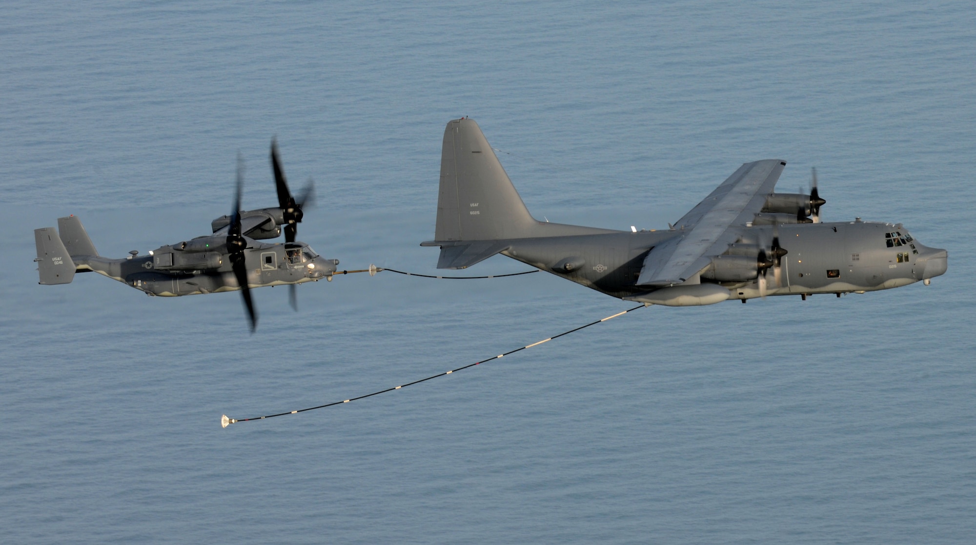 An MC-130P Combat Shadow from the 67th Special Operations Squadron refuels a CV-22 Osprey from the 7th Special Operations Squadron Jan. 24, 2014. The flight was the Combat Shadow’s last training mission while assigned to the 352nd Special Operations Group. U.S. Air Force Maj. Gen. Marshall B. Webb, U.S. Special Operations Command Europe commander, piloted the Osprey during his visit to the 352nd Special Operations Group, one of several components of SOCEUR. SOCEUR is a subordinate unified command of U.S. European Command exercising operational control of theater Army, Navy and Air Force Special Operations Forces. (U.S. Air Force photo by Senior Airman Kate Maurer/Released)