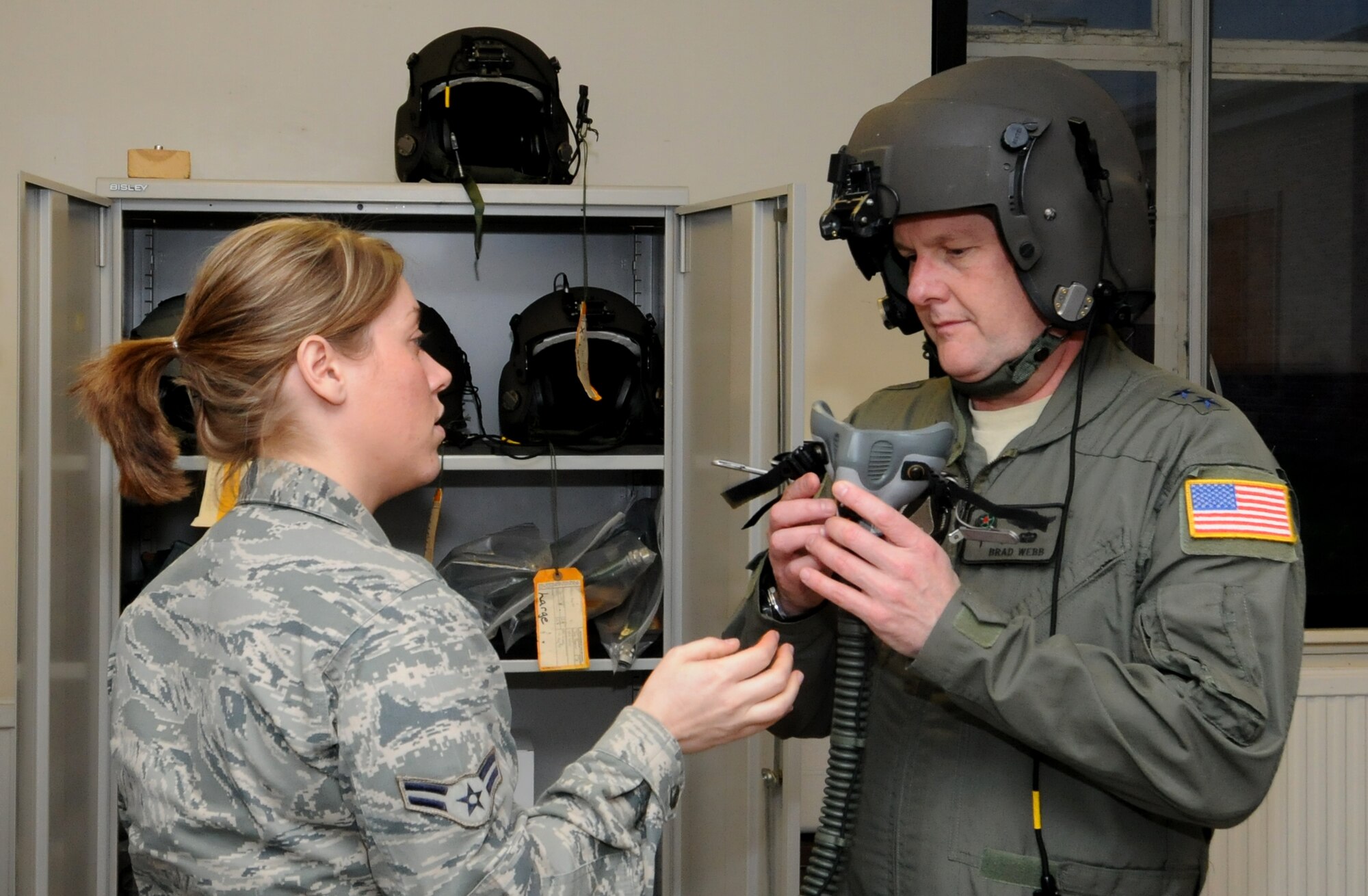 U.S. Air Force Airman 1st Class Amanda Adams, 352nd Special Operations Support Squadron Aircrew Flight Equipment technician from Hastings, Minn., fits U.S. Air Force Maj. Gen. Marshall B. Webb, U.S. Special Operations Command Europe commander, with a flight mask Jan. 23, 2014, in preparation for a flight aboard a CV-22 Osprey as part of his visit to RAF Mildenhall, England. Webb met with Airmen assigned to the 352nd Special Operations Group, its subordinate units and other units under his command during his visit. (U.S. Air Force photo by Tech. Sgt. Neal X. Joiner/Released)