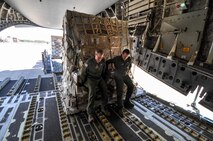 Humanitarian aid being offloaded from a Charleston based C-17 Globemaster III by Master Sgt. Tom House (left) and Tech. Josh Fugle from the 701st Airlift Squadron.  The donated humanitarian aid was delivered to Panama and Honduras. (U.S. Air Force Photo/Maj. Wayne Capps)
