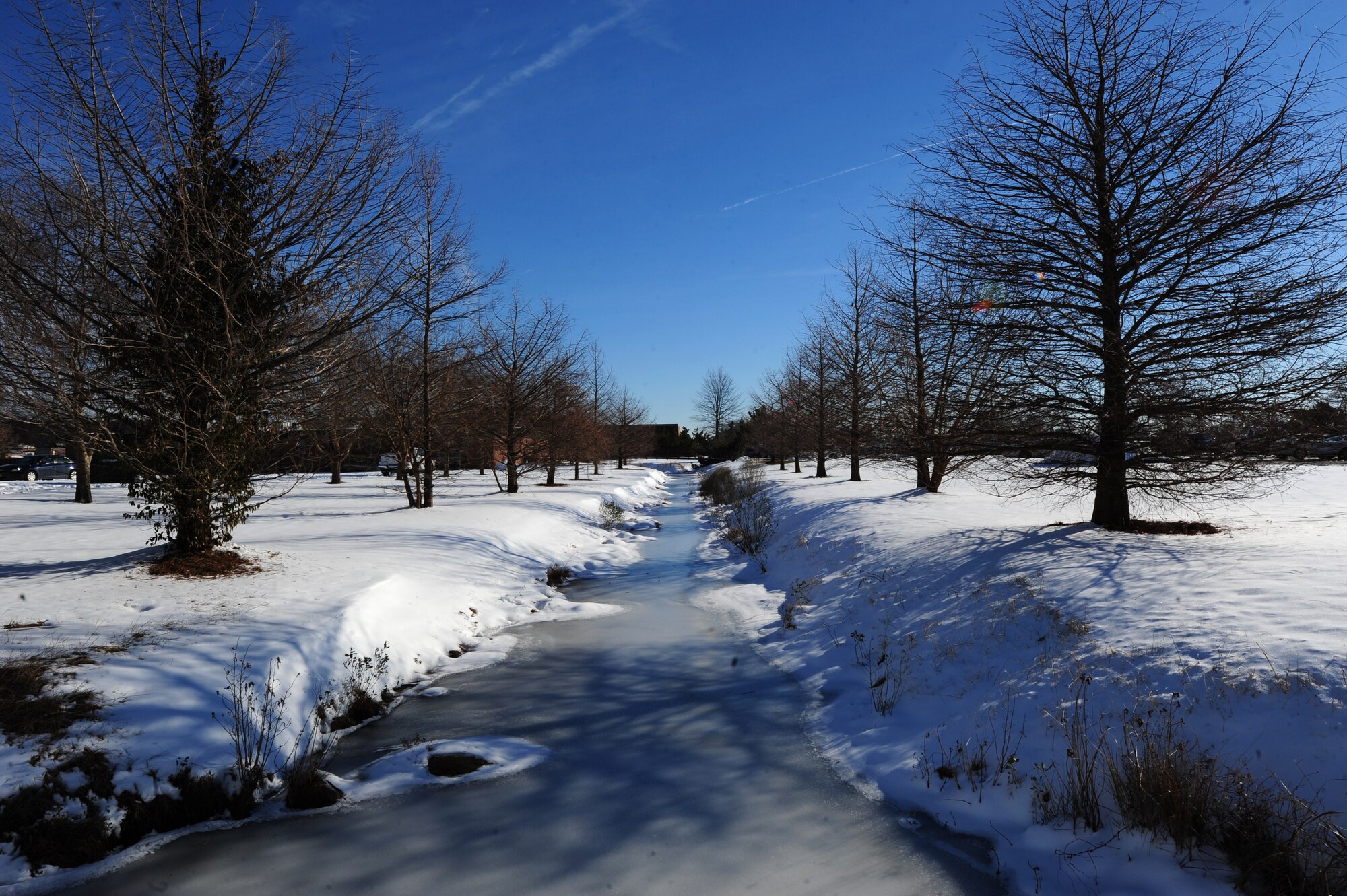 The river, near the 633rd Medical Group Physical Therapy facility, remains frozen at Langley Air Force Base, Va., Jan. 31, 2014. Low temperatures and snowfall, which began Jan. 28, caused the river to freeze. (U.S. Air Force photo by Airman 1st Class Areca T. Wilson/Released) 