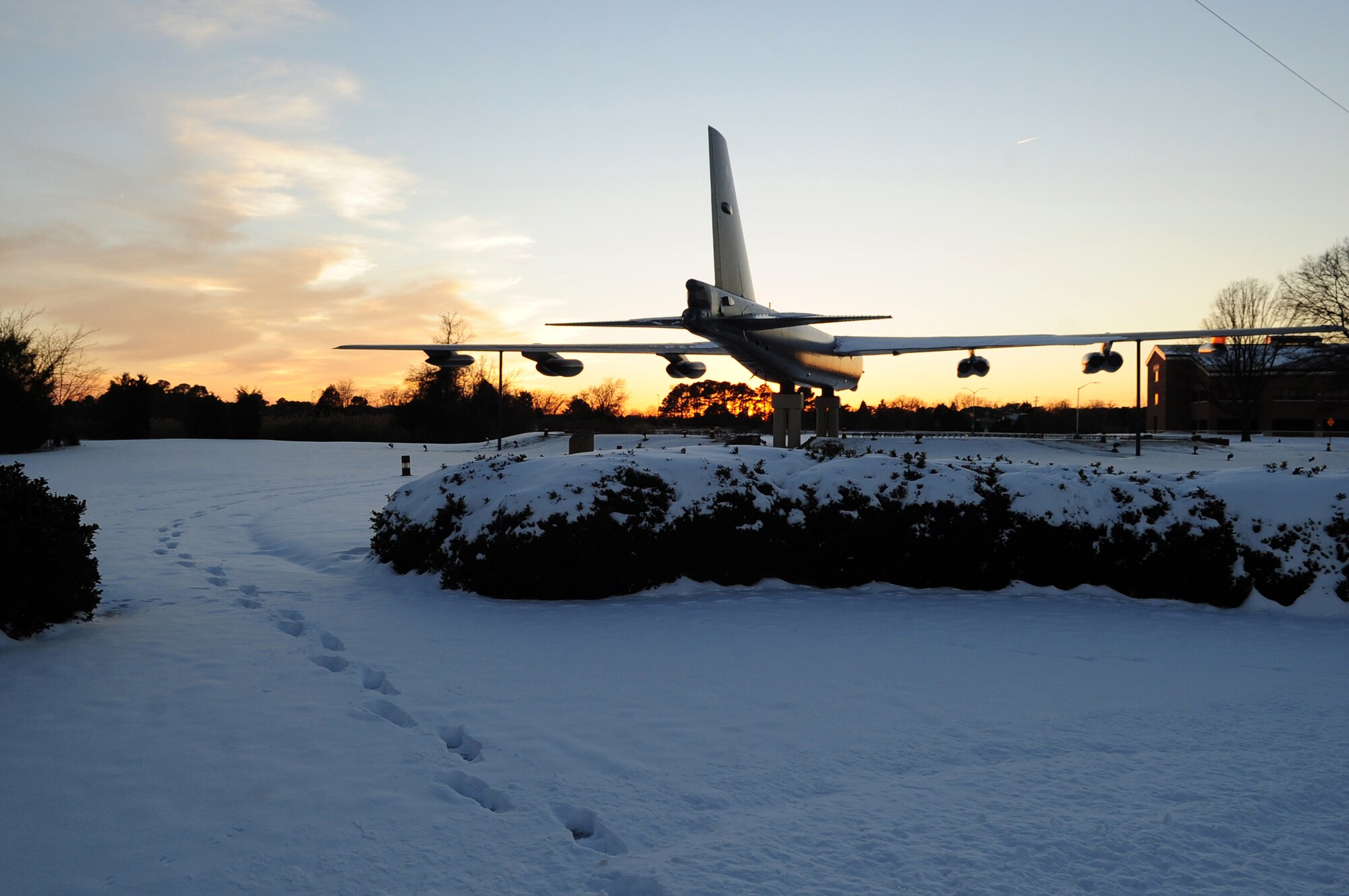 Footprints lead to the Boeing B-52 Stratofortress (bomber) display near the La Salle gate at Langley Air Force Base, Va., Jan. 30, 2014. The snowfall, which began Jan. 28, forced several schools around the Hampton Roads area to close for several days. (U.S. Air Force photo by Airman 1st Class Areca T. Wilson/Released)