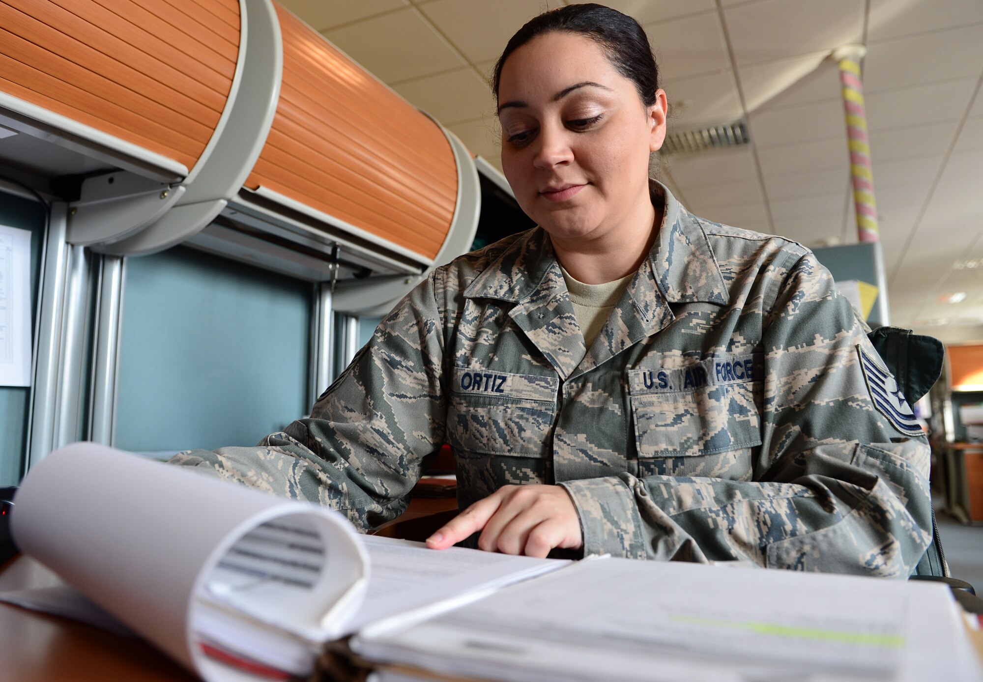 Tech Sgt. Tamika Ortiz, 48th Contracting Squadron contracting specialist, reviews a contract at Royal Air Force Lakenheath, England, Jan. 27, 2014. Ortiz was nominated for a Liberty Spotlight because she displays the core value of ‘Service Before Self.’ (U.S. Air Force photo by Airman 1st Class Dawn M. Weber/Released)  
