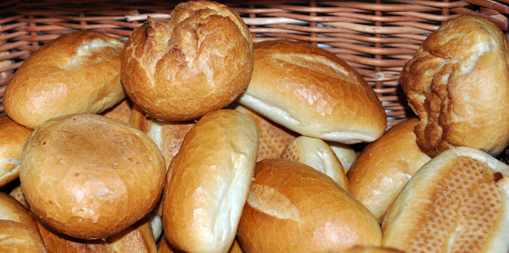 Plain white bread rolls are continuously baked in most bakeries, so they are always available and fresh. Among the white rolls you can typically also find soft white rolls, the Milchbroetchen or milk rolls or the airy type, called Wasserweck or water roll. These rolls are mainly for those who prefer the traditional style breads. While rolls are simplycalled "Broetchen" in most parts of the country. The best choice is usually a mix of some dark rolls, seed rolls (sesame seeds, sunflower seeds or caraway seeds) and plain white rolls. At local bakeries you may just simply point to what you would like. (U.S. Air Force photo by Iris Reiff/Released)